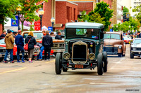 1931 Ford pickup hot rod entering downtown