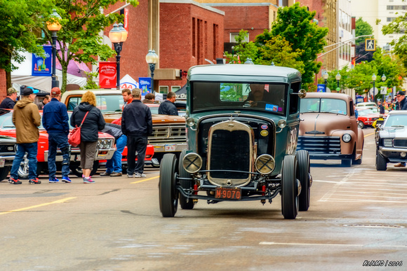 1931 Ford pickup hot rod entering downtown