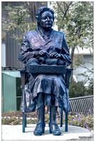 Statue of Immigrant Woman Knitting