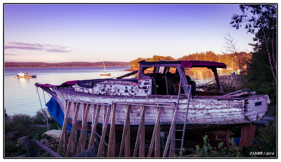 Boat in Disrepair Near Sunset