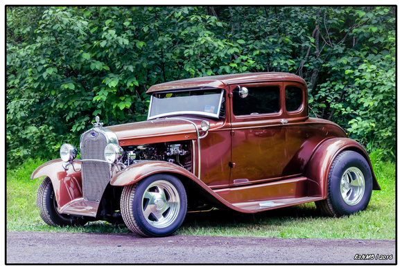 1930 Ford Model A 5 window coupe in light rain